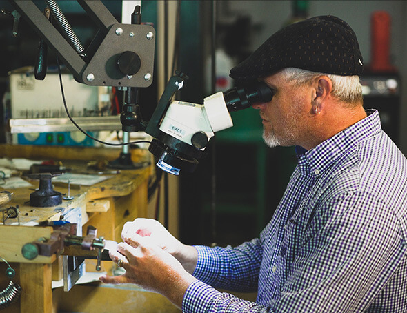 The technician performing jewelry repair