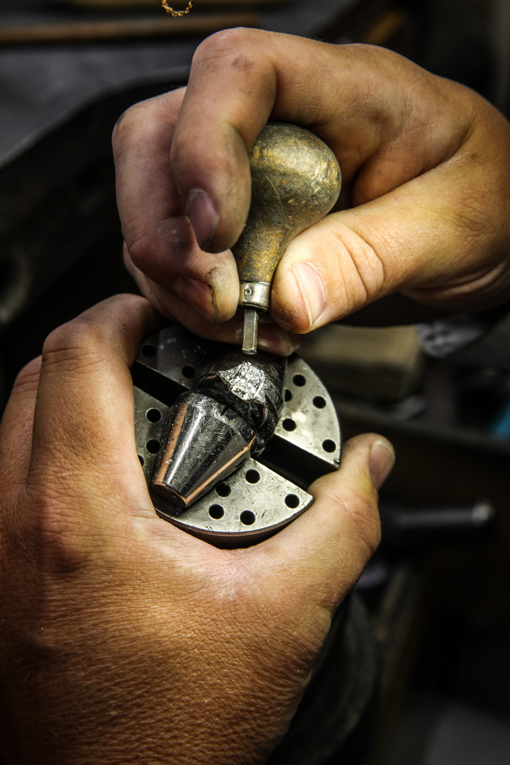 Jewelers Hands Setting Diamond